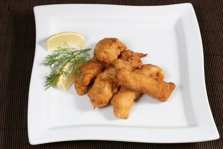 baked in pastry chicken with lemon and herbsの写真素材