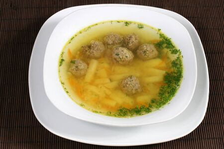 soup with meatballs and greensの写真素材