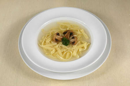 portion of mushroom soup with noodlesの写真素材