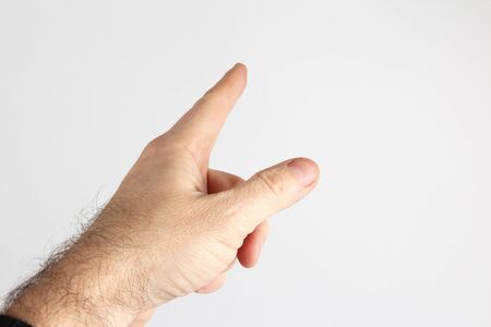 gesture with the index finger of the hand on a light backgroundの写真素材
