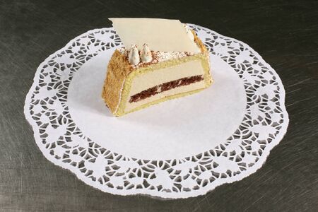 sweet cake on a white napkin on a grey backgroundの写真素材