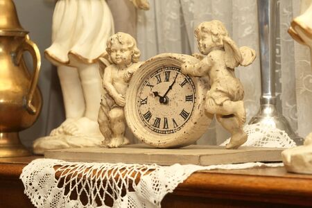 antique clock with two figures of angelsの写真素材