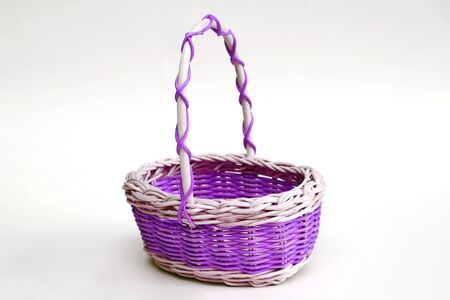 decorative wicker basket made of wicker on a light backgroundの写真素材