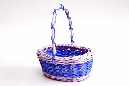 decorative wicker basket made of wicker on a light backgroundの写真素材