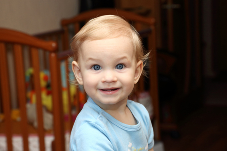portrait smiling year old blonde girl with beautiful eyesの写真素材