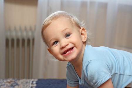 portrait smiling year old blonde girl with beautiful eyesの写真素材
