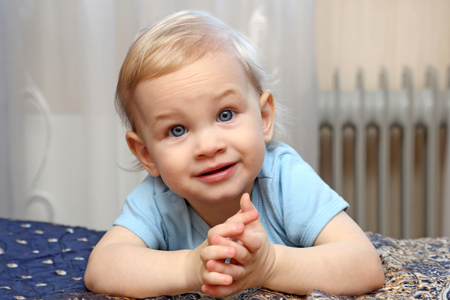 portrait of blond little girl with beautiful eyesの写真素材