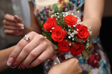 the bridesmaid wearing a beautiful bouquet in handの写真素材
