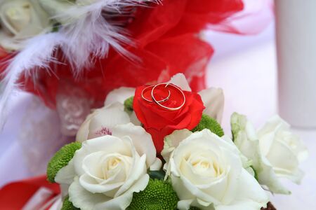 Wedding rings on bride's bouquetの写真素材