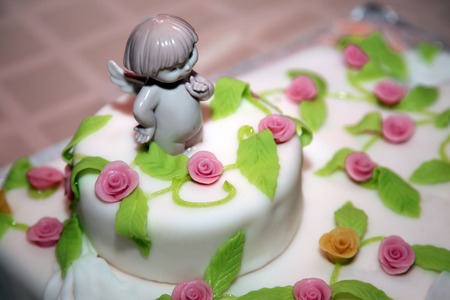 decorative angel figurine on top of a wedding cakeの写真素材