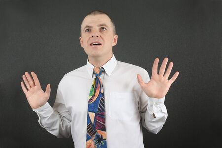 business man with arms raised looking upの写真素材