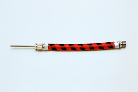 the hose with a needle to inflate the ballの写真素材