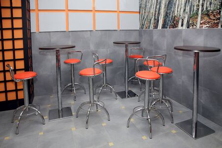 tables and chairs in the interior of the cafeのeditorial素材