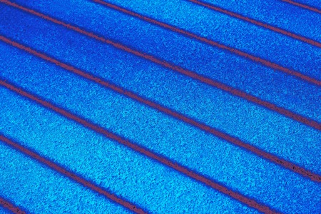 bright blue texture of the concrete surface with stripes