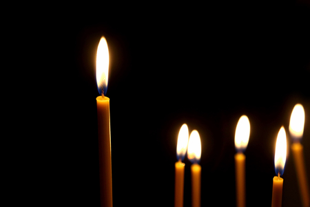 wax candles burning in the dark