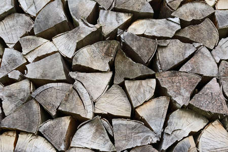 stack of dry wooden logs for the fireの写真素材