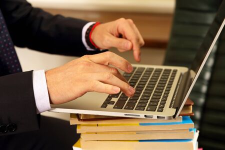 hands of business people working on laptopの写真素材