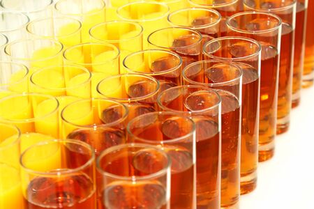 many glasses with different juiceの写真素材