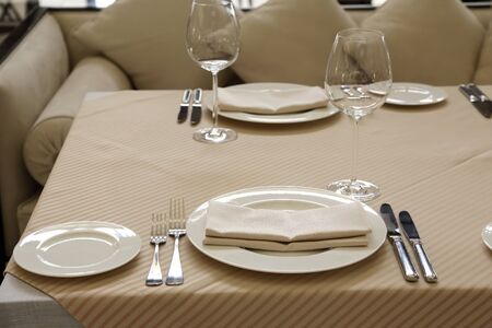 serving dishes on the table in the restaurantの写真素材