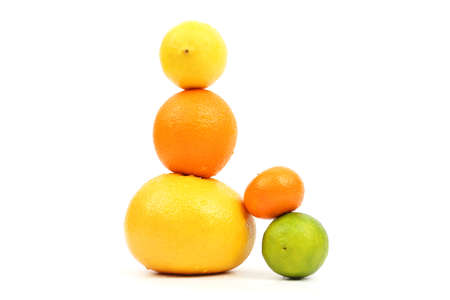 exposed pyramid of citrus fruits on white backgroundの写真素材