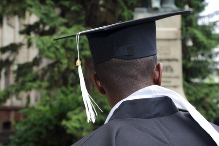 african student in the form of a university graduate  from behind closeupの写真素材