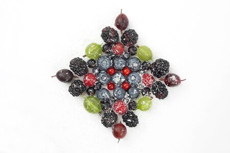 lot of different berries in the shape of a square on a white background