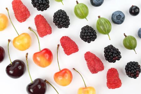 different berries in order laid out on a white backgroundの写真素材