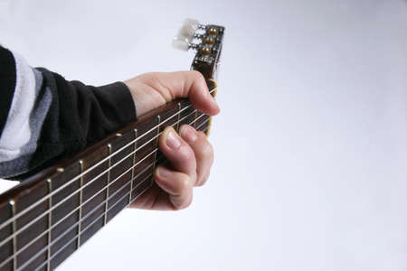 in the chord playing classical guitar closeup