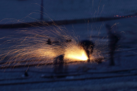 sparks from the metal work in the dark