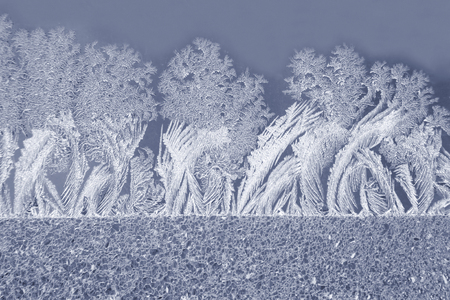 the unique ice patterns on window glassの写真素材