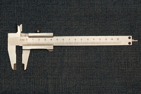 tool micrometer in jeans