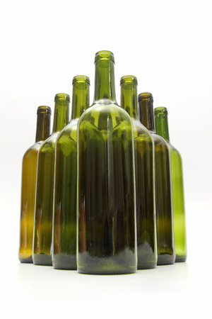 empty bottles of wine on white backgroundの写真素材