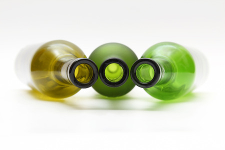 empty bottles of wine on white backgroundの写真素材