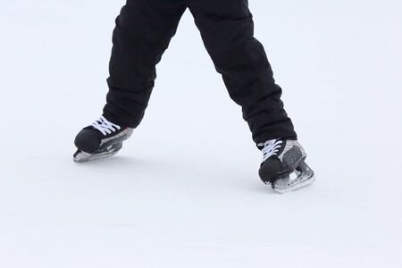 feet rolling on skates man on the ice rinkの写真素材