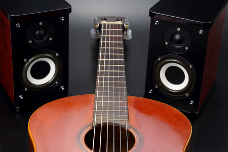 two stereo audio speakers, and classical acoustic guitar
の写真素材