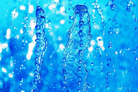 drops blue water of the fountain in the skyの写真素材