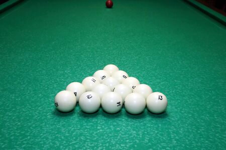 set of balls for Billiards on green table