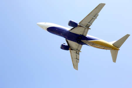 passenger jet flies in skyの写真素材