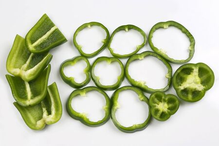 cut into pieces green peppers on white background
の写真素材