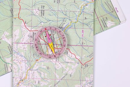 magnetic compass on map background