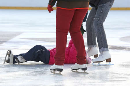 people skating on the ice rinkの写真素材