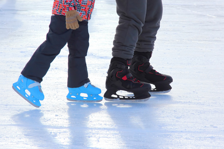 the legs of the child and adult ice skating rink
の写真素材