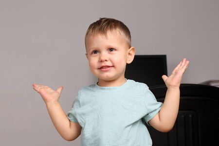 portrait of baby with arms raised