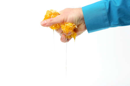 honey from dripping down handsの写真素材