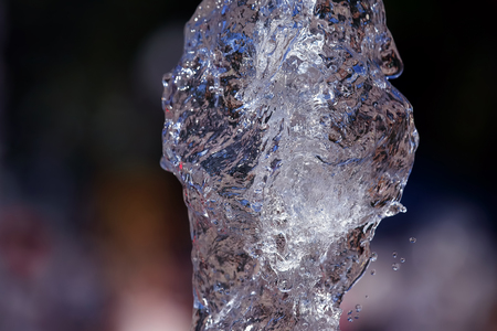 Splashes of flying water from the fountainの写真素材