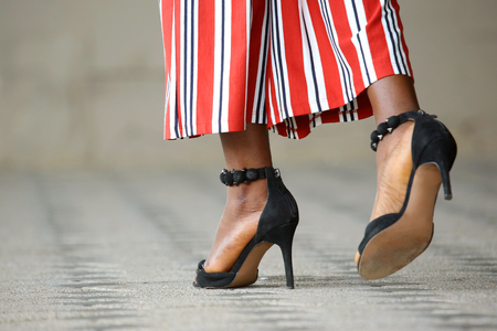 women's feet in heelsの写真素材