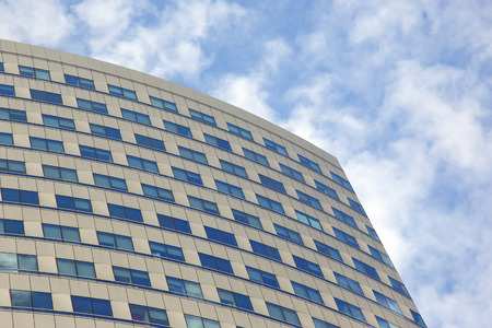 The facade of the building with Windows on the background of blue sky
