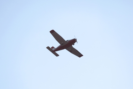 single-engine light aircraft flying in the skyの写真素材