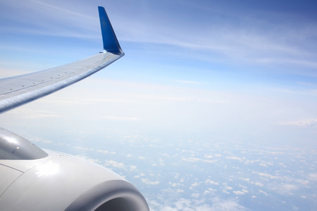 The wing of an airplane above the clouds