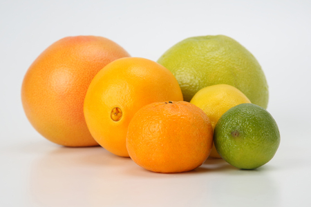 different citrus fruits on white backgroundの写真素材